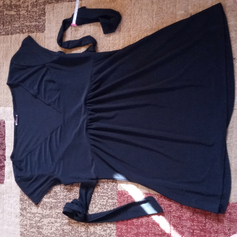 Women's cute black blouse,it ties in the back.